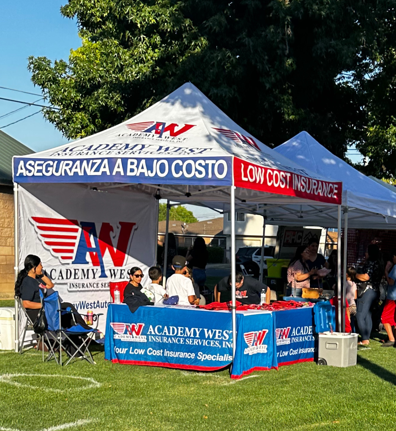 Academy West Insurance branded event tent and table cover